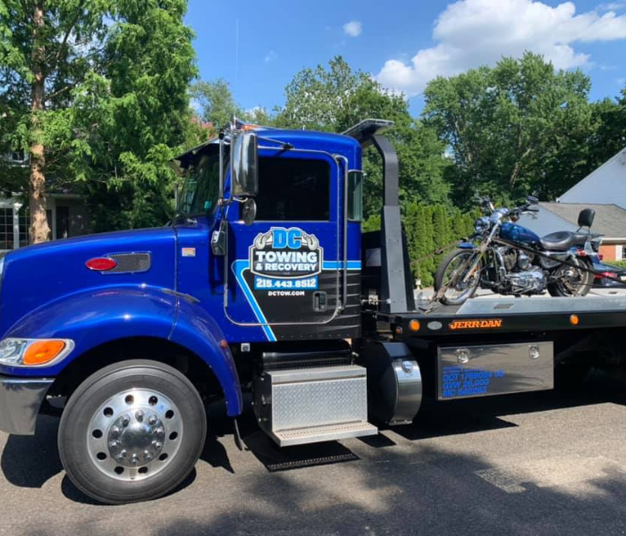 tow truck hauling a motorcyle 